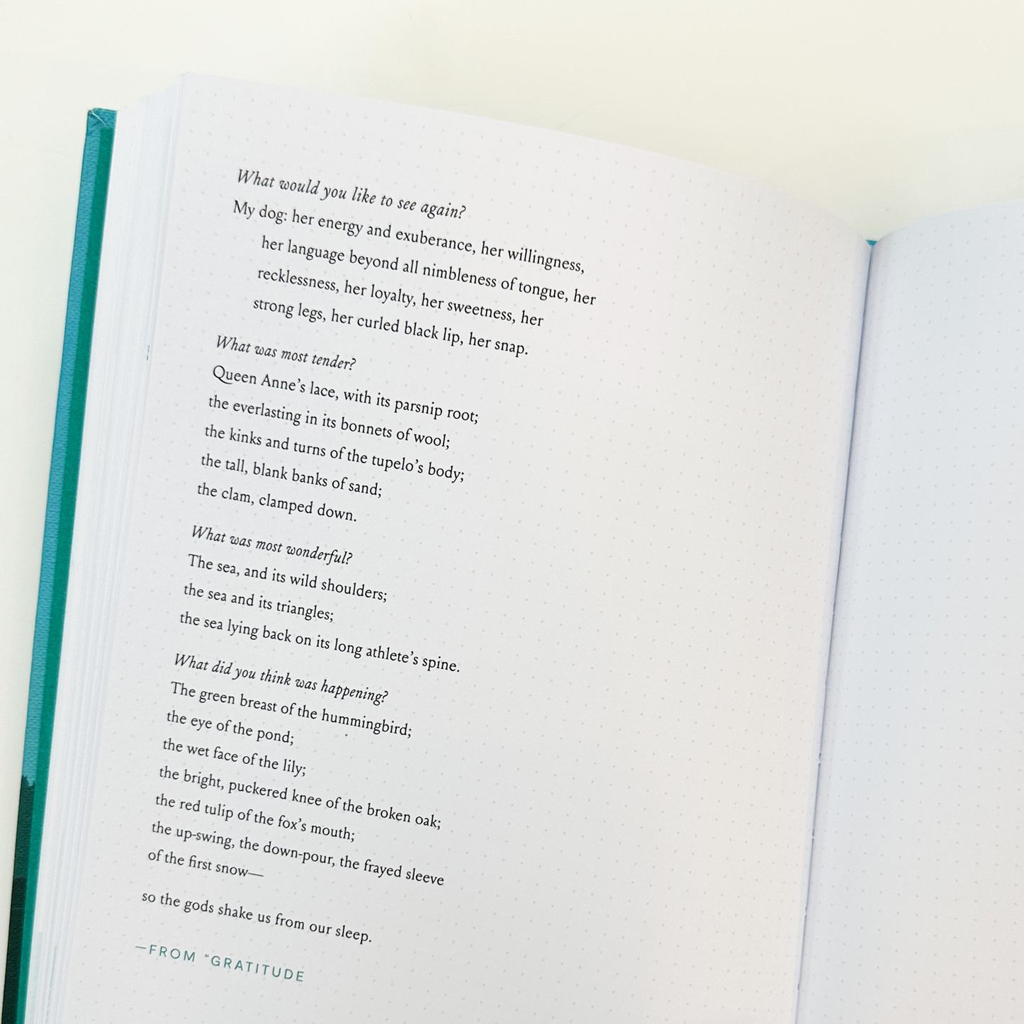 Open book featuring poetic text
