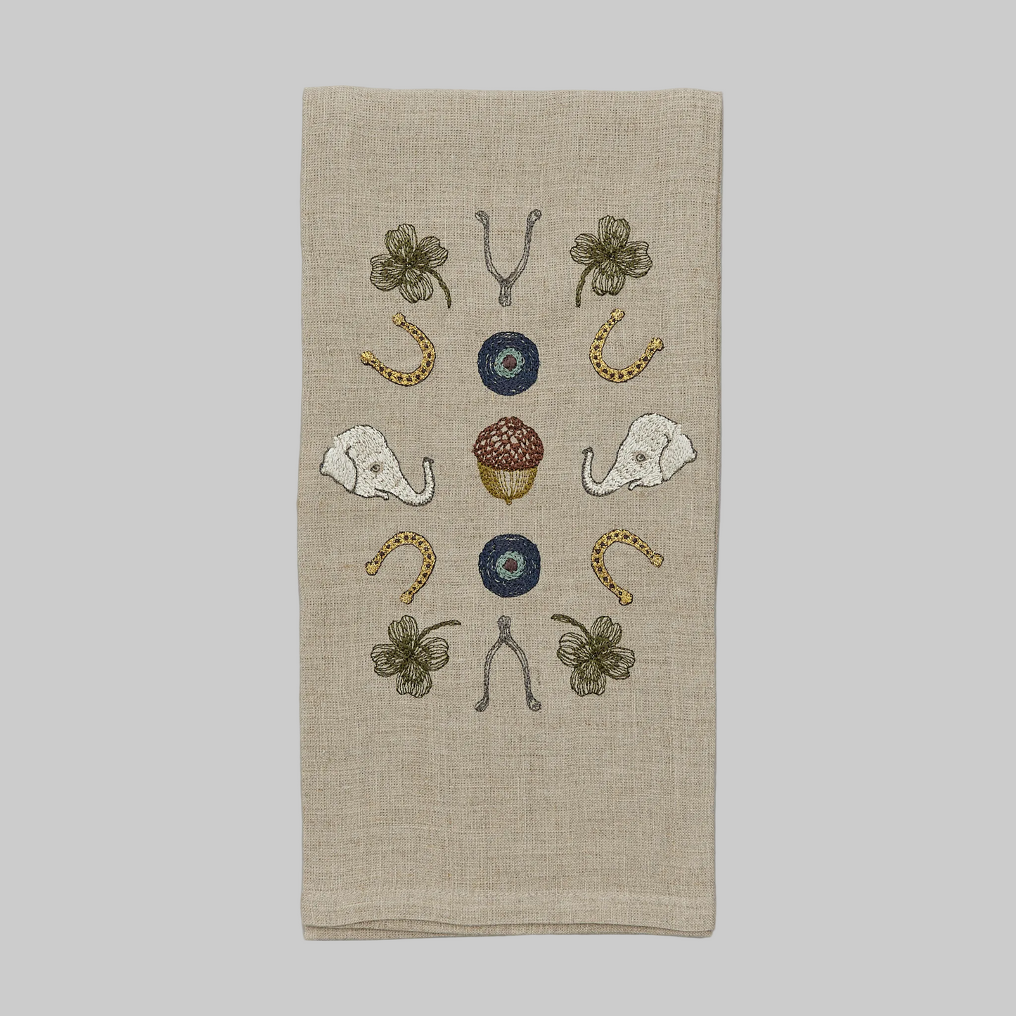 Coral and Tusk’s “Good Luck” embroidered linen tea towel featuring lucky charms