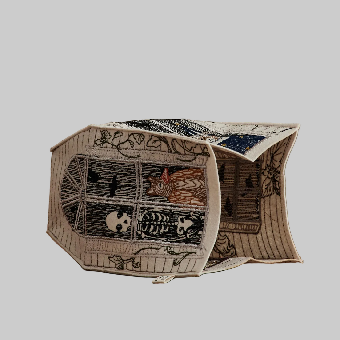 Coral and Tusk's "Haunted House" tissue box cover made of felt and embroidered with Halloween designs