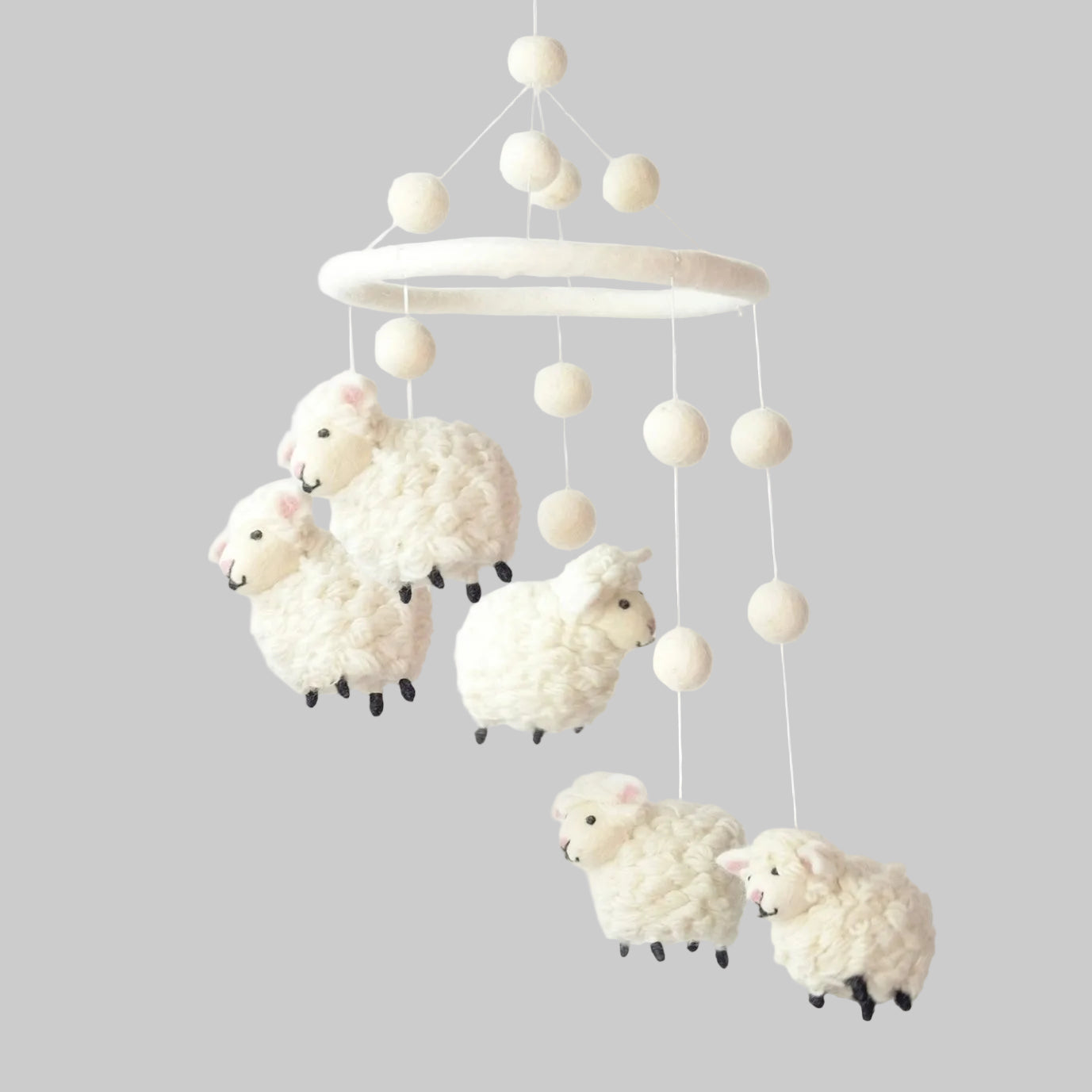 The Winding Road’s wool-felted baby mobile with white sheep, handmade and fair trade