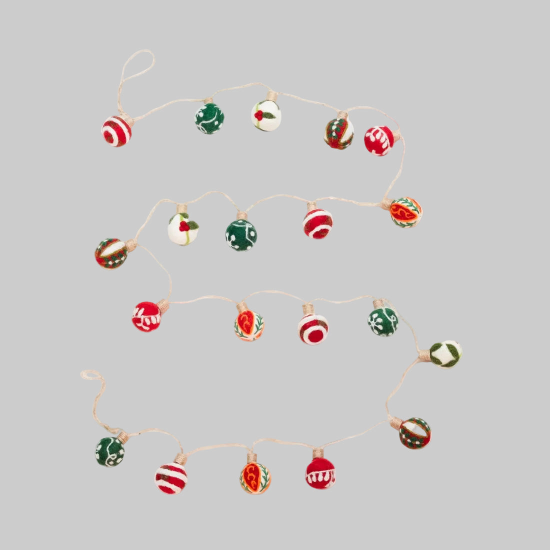 The Winding Road's wool-felted holiday garland featuring embroidered ornaments. Handmade and fair trade.