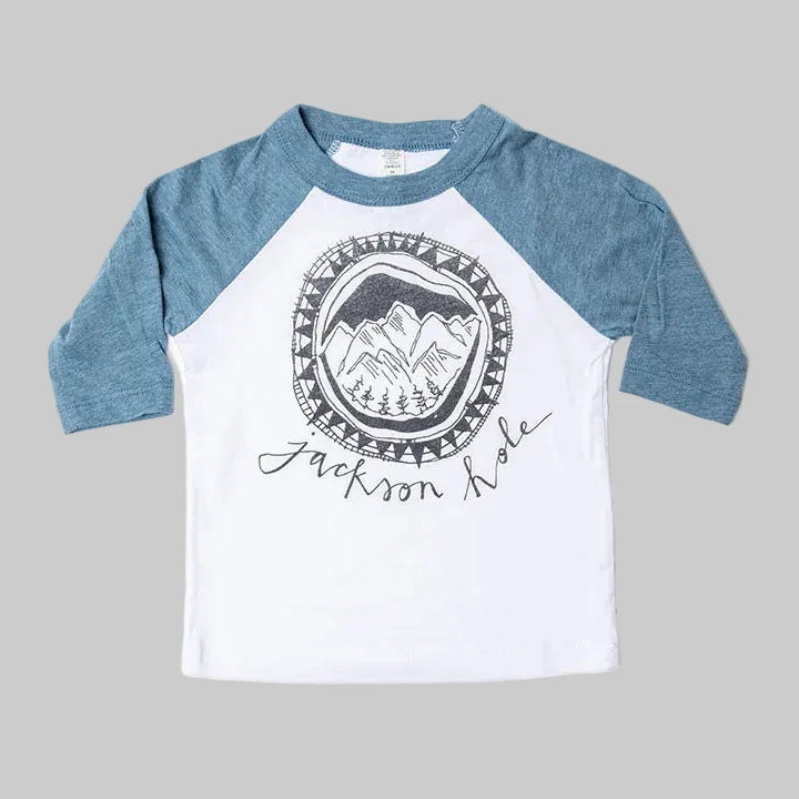 Bird and Buffalo’s kids baseball tee with blue sleeves and a mountain logo design, locally made in Jackson Hole, WY