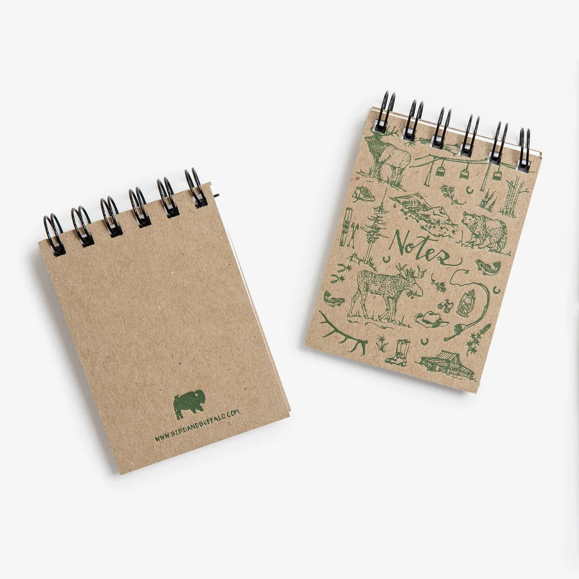 Two small notebooks with green letterpress illustrations 