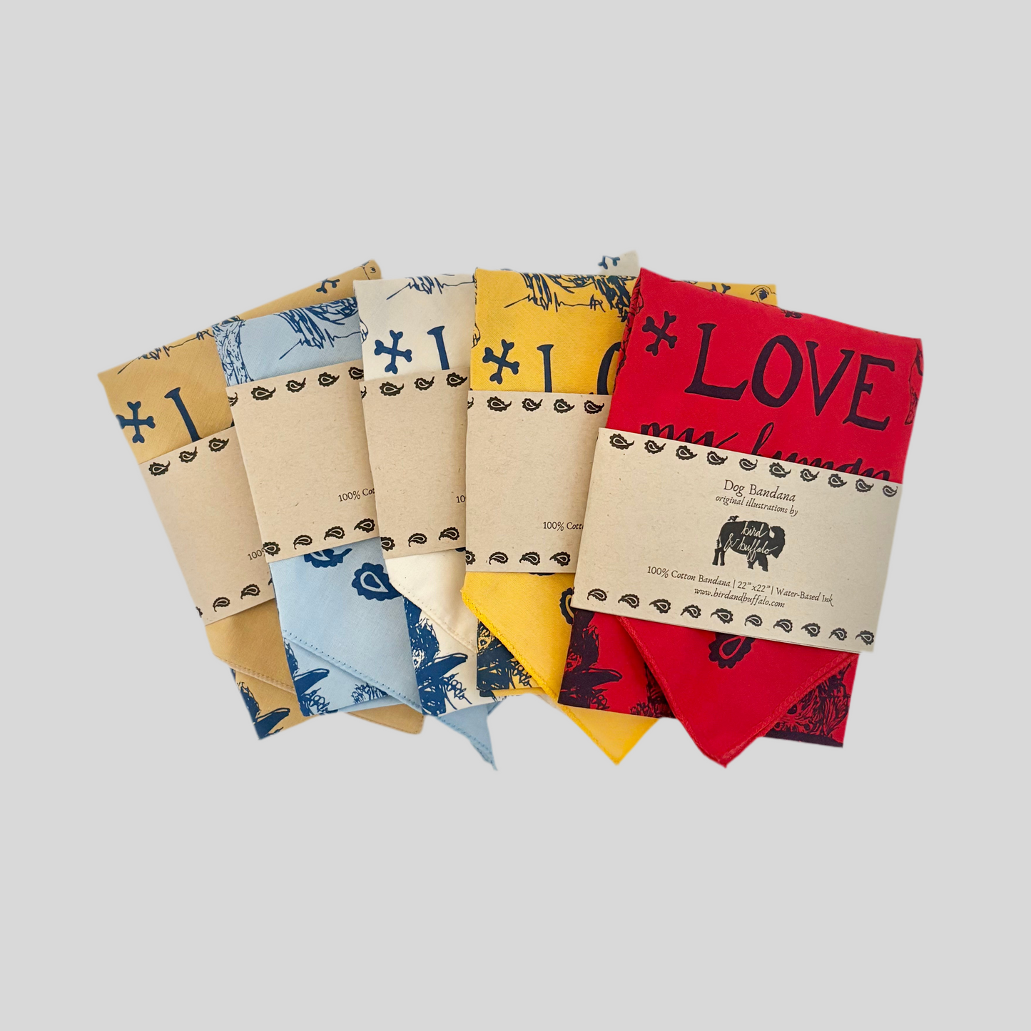 Set of colorful dog bandanas with various patterns and text on a light gray background