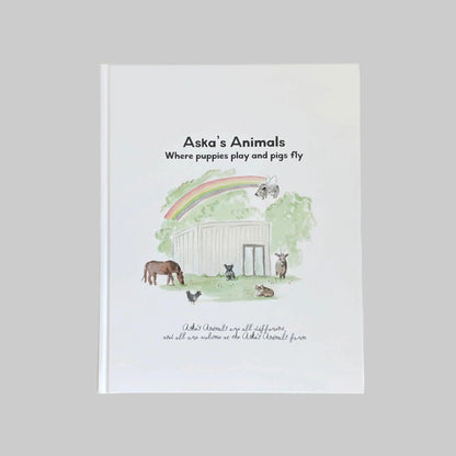 Book cover of 'Aska's Animals' with illustrations of animals and a rainbow