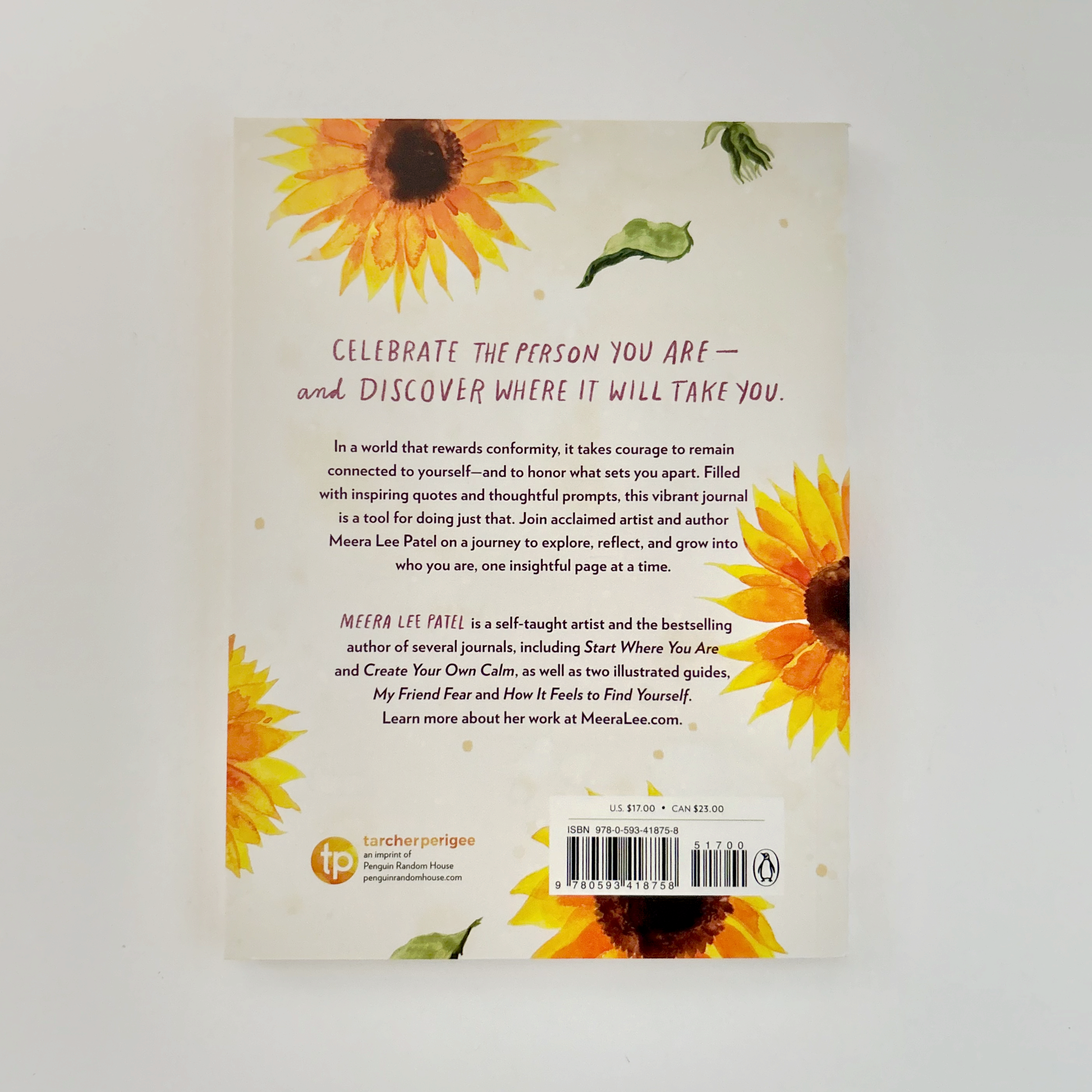 Book back cover with sunflower illustrations and text.