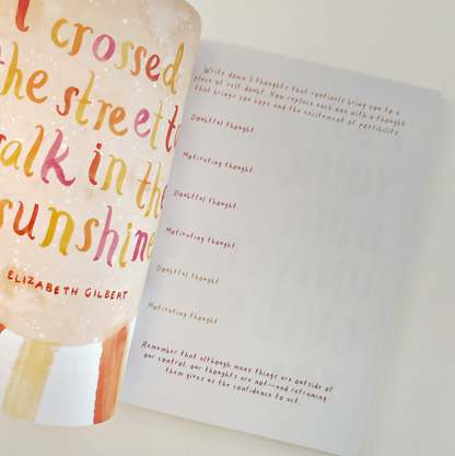 Open book with colorful text on a white background