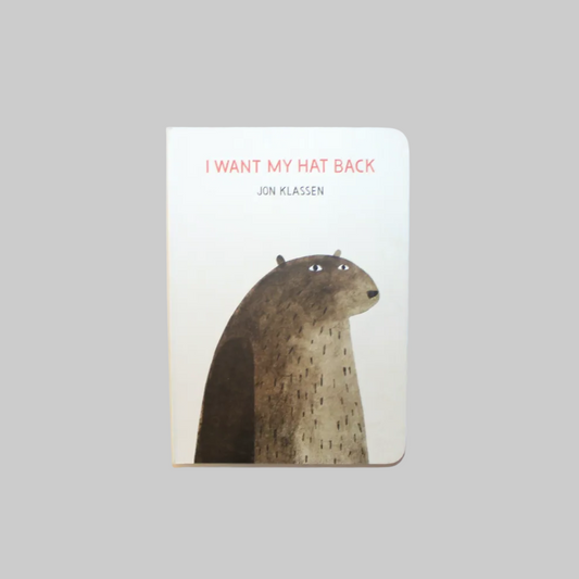 A board book titled 'I WANT MY HAT BACK' by Jon Klassen with an illustration of a bear on the cover.
