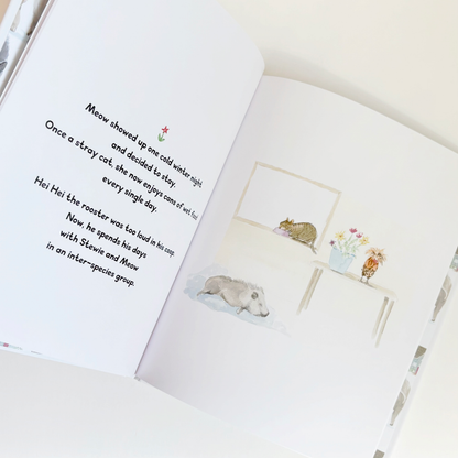 Open book with illustrations of animals and text on a white background