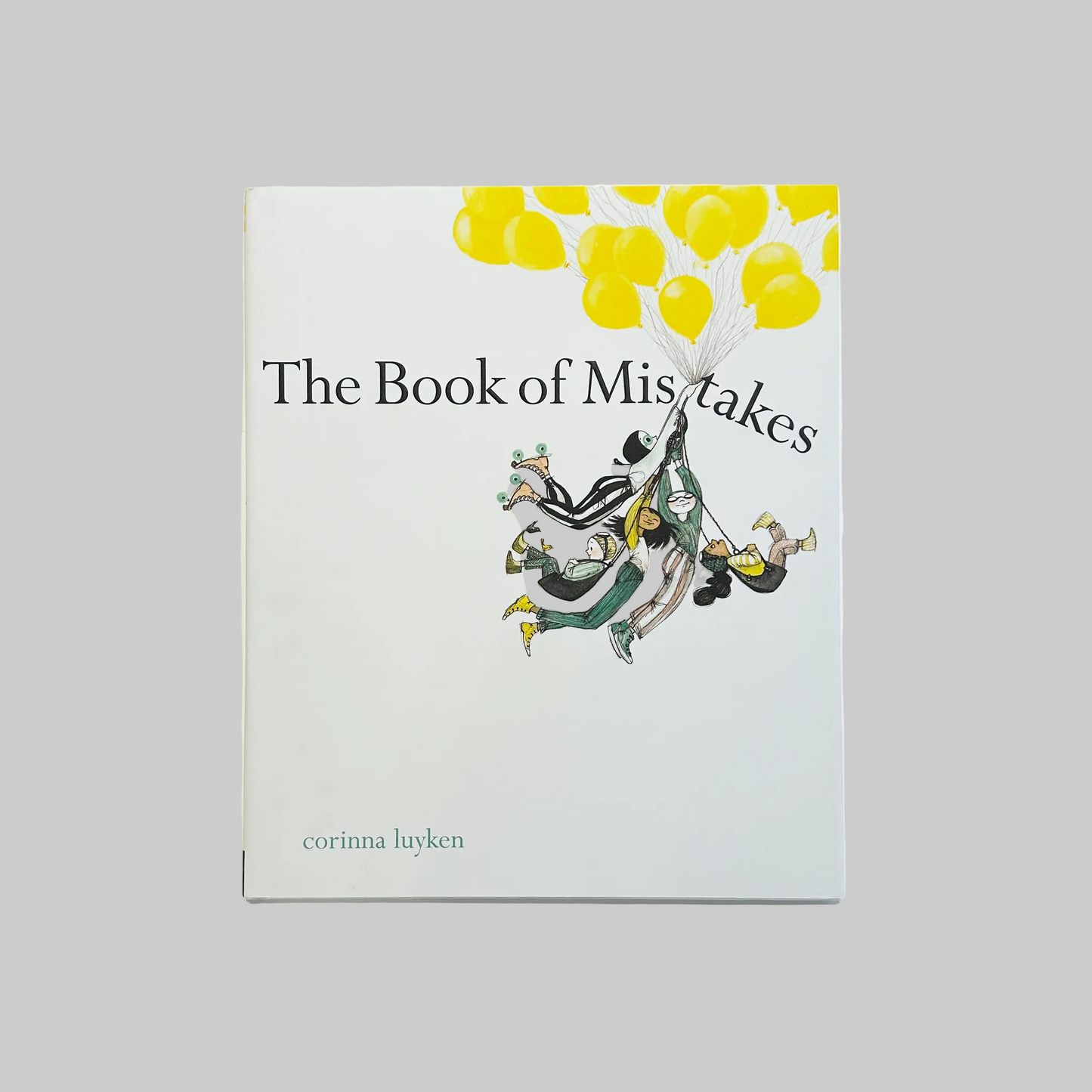 The cover of 'The Book of Mistakes' by Corinna Luyken featuring a white background with illustrations of yellow balloons and whimsical characters