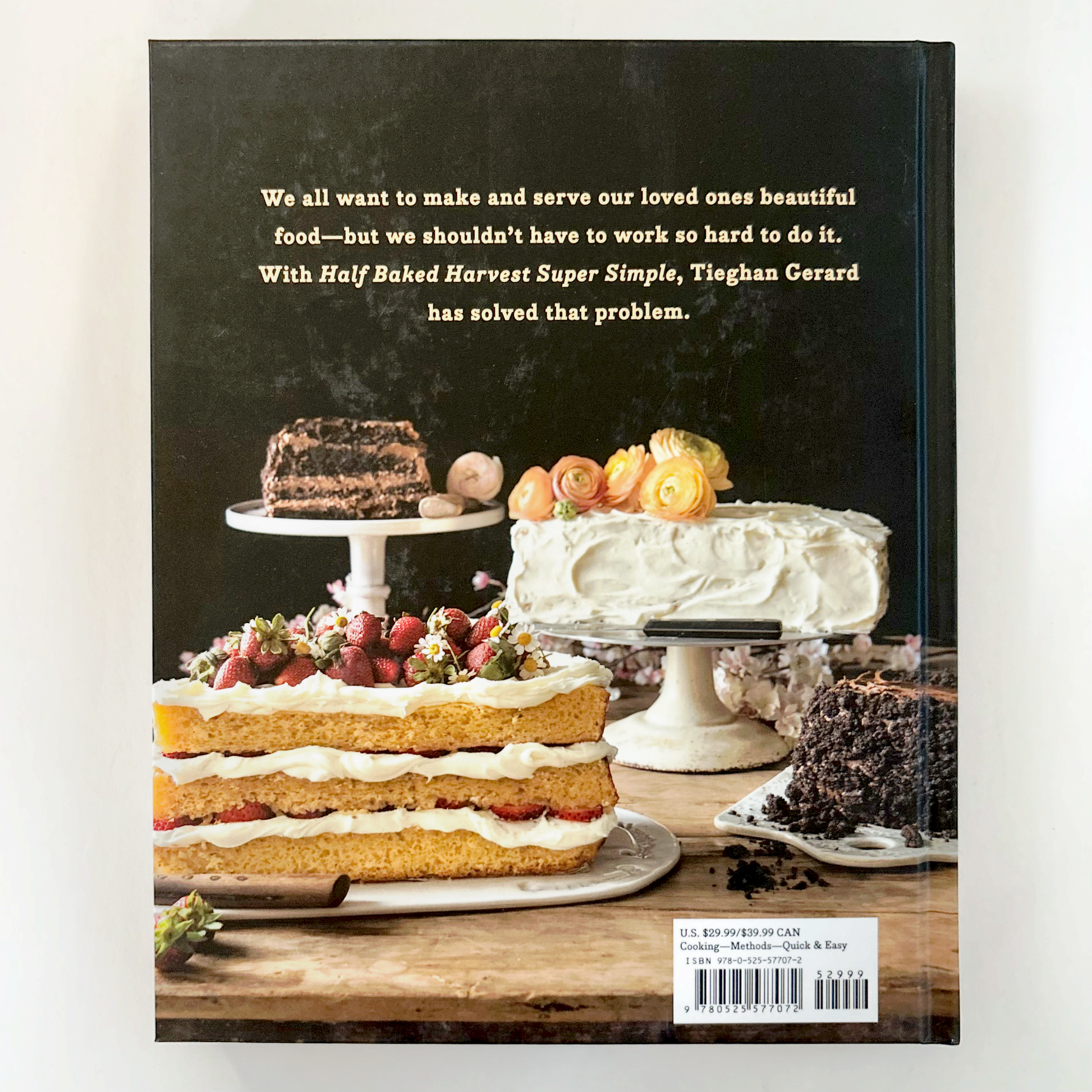 Book cover with images of cakes and a quote about simplifying baking.