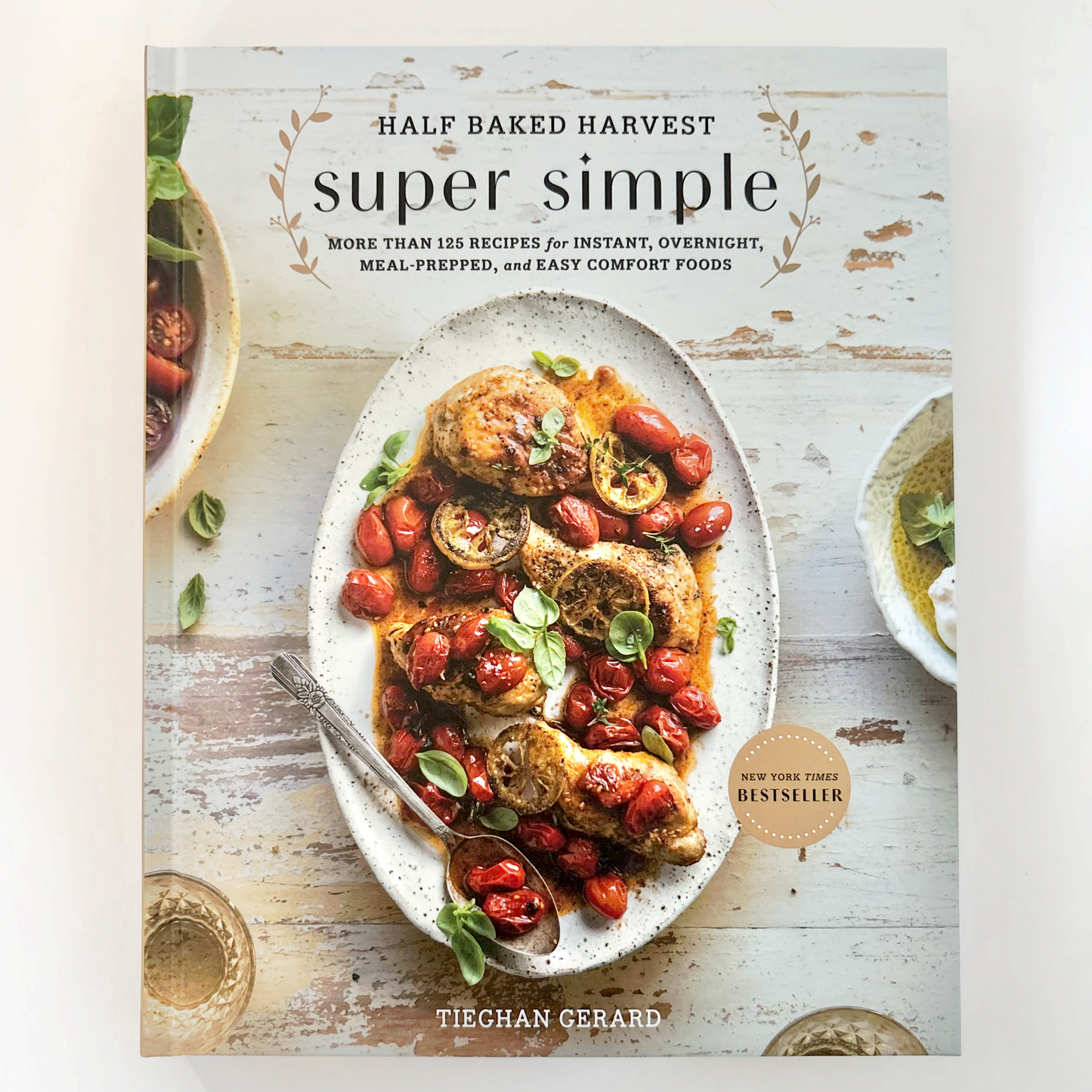 Book cover of 'Super Simple' by Half Baked Harvest with a dish of food on a wooden surface.