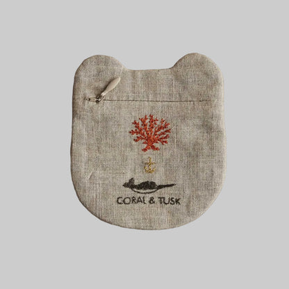 Linen pouch with coral and tusk design on a beige background