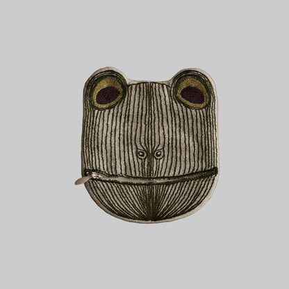 Frog-shaped pouch with a zipper on a beige background