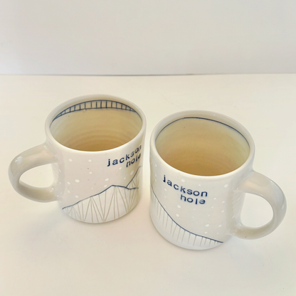 Two white mugs with 'Jackson Hole' branding