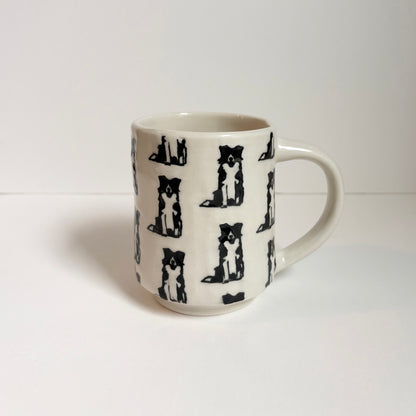 White mug with black border collie pattern 