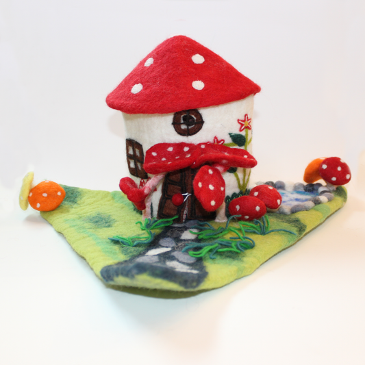 Felted fairy house decorated with mushrooms from The Winding Road