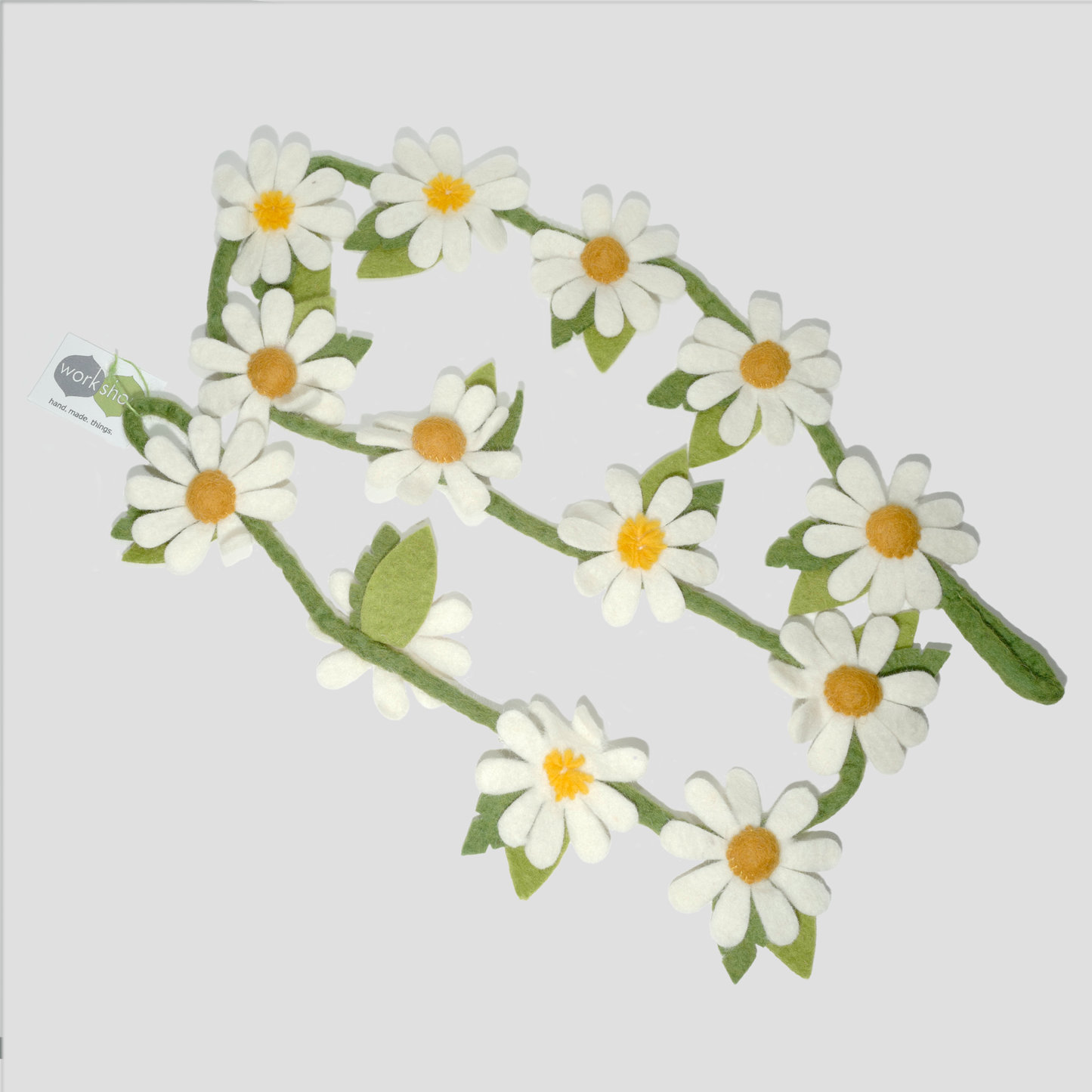 Felted garland with white daisies and green leaves