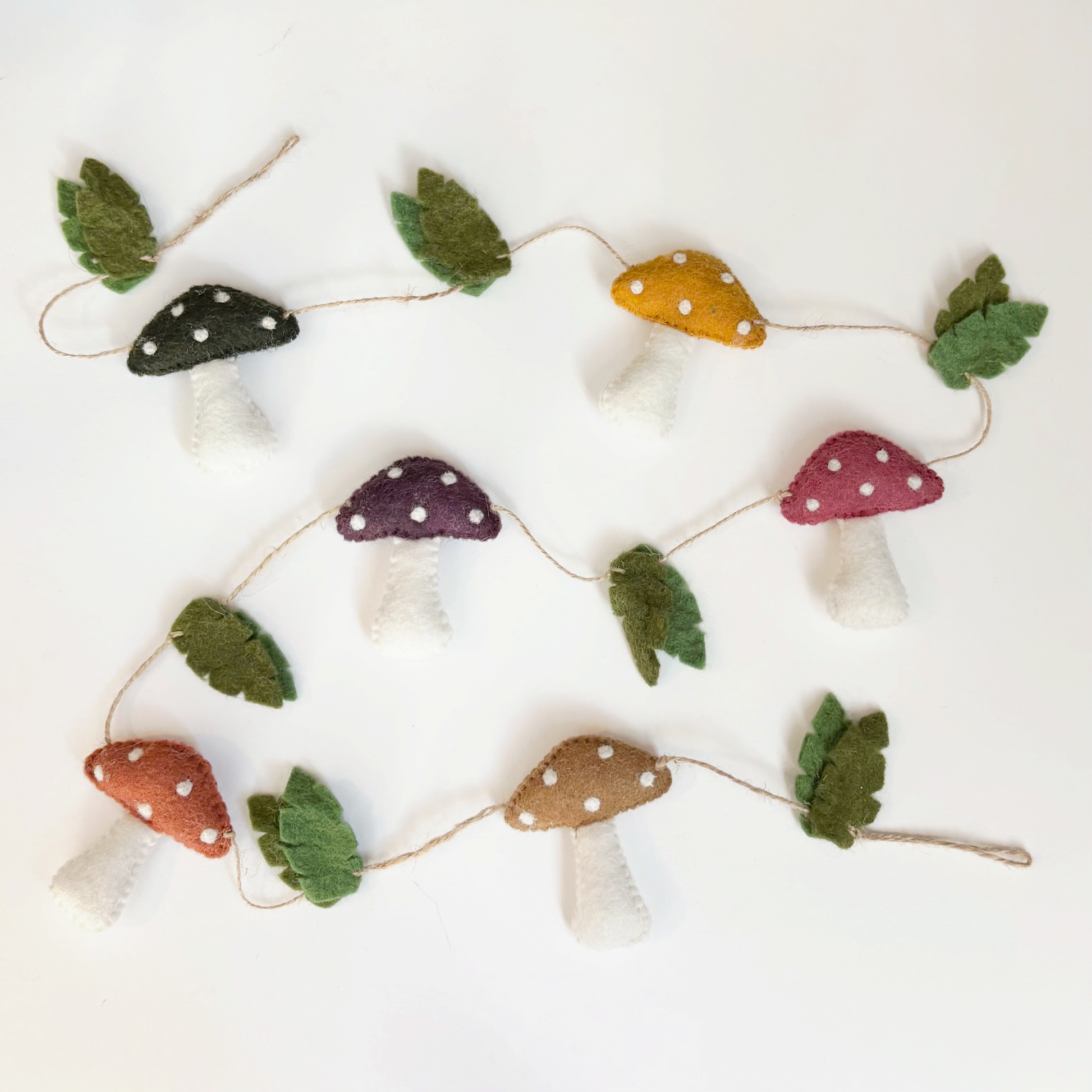 Decorative string with natural colored mushroom and leaf shapes