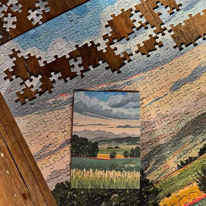 A.T. Patterson's puzzle featuring an original landscape art print.