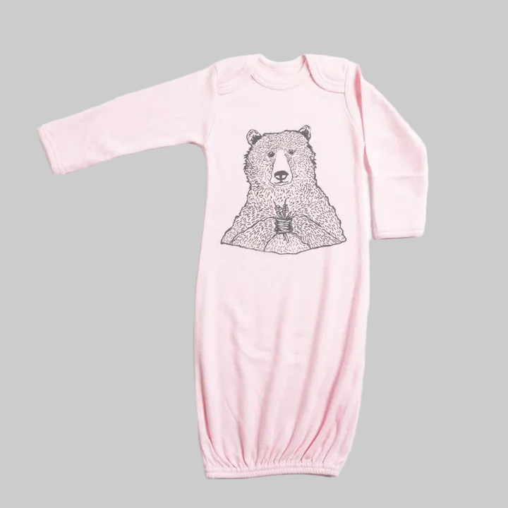 Bird and Buffalo’s baby gown in pink featuring bear holding flowers design, made locally in Jackson Hole, WY