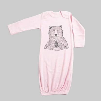Bird and Buffalo’s baby gown in pink featuring bear holding flowers design, made locally in Jackson Hole, WY