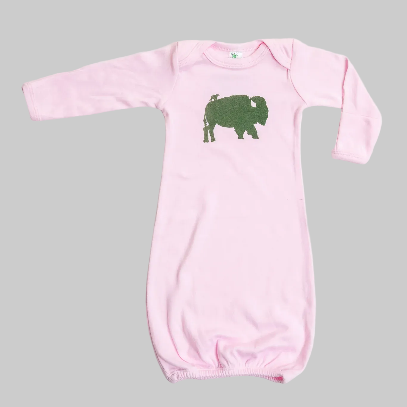 Bird and Buffalo’s baby gown in pink featuring bird and buffalo design, made locally in Jackson Hole, WY