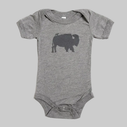 Bird and Buffalo’s baby onesie in gray with a bird and buffalo design, made locally in Jackson Hole, WY