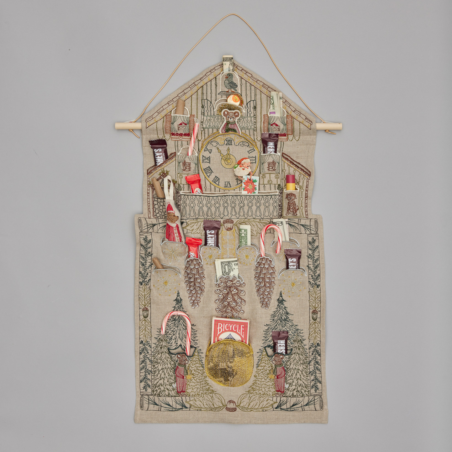 Coral and Tusk's "Christmas Clock" advent calendar featuring intricate embroidery and pockets for small gifts