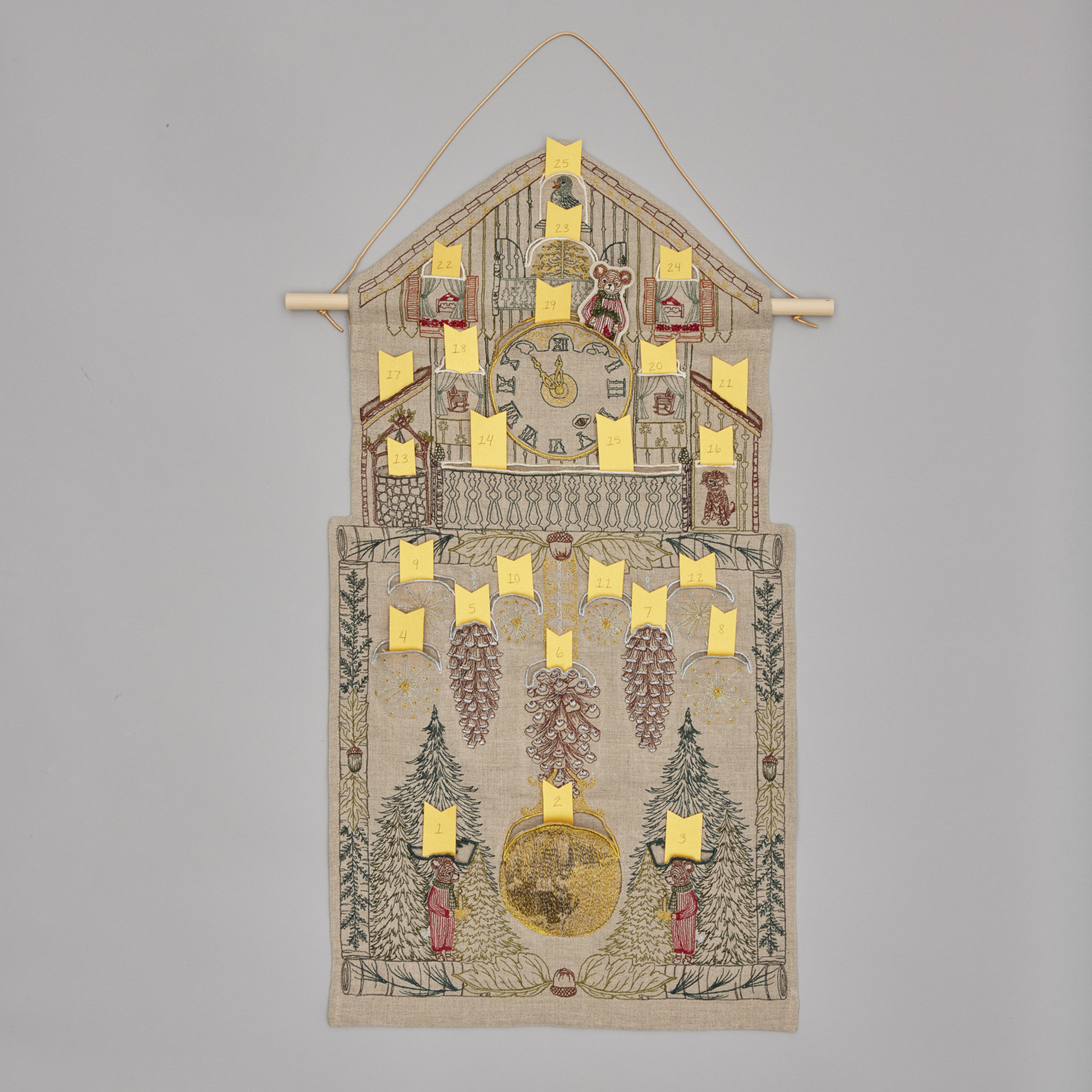 Coral and Tusk's "Christmas Clock" advent calendar featuring intricate embroidery and pockets for small gifts