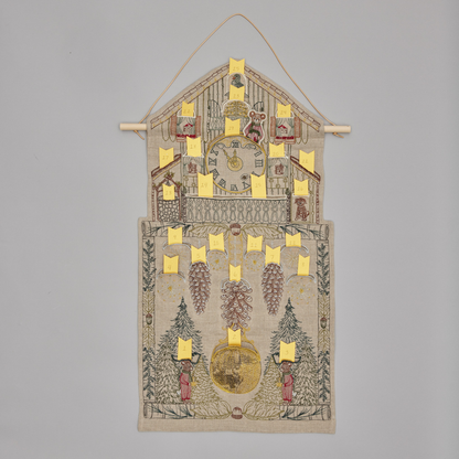Coral and Tusk's "Christmas Clock" advent calendar featuring intricate embroidery and pockets for small gifts