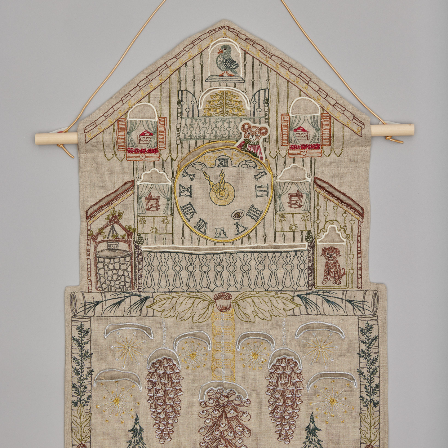 Coral and Tusk's "Christmas Clock" advent calendar featuring intricate embroidery and pockets for small gifts