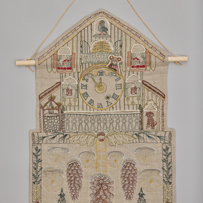 Coral and Tusk's "Christmas Clock" advent calendar featuring intricate embroidery and pockets for small gifts