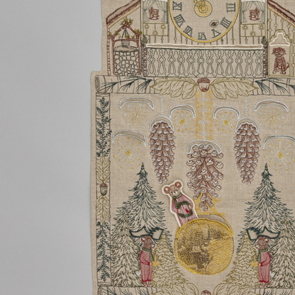 Coral and Tusk's "Christmas Clock" advent calendar featuring intricate embroidery and pockets for little gifts