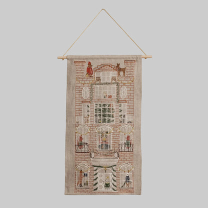 Coral and Tusk's "Holiday House" advent calendar featuring intricate embroidery and pockets for small gifts