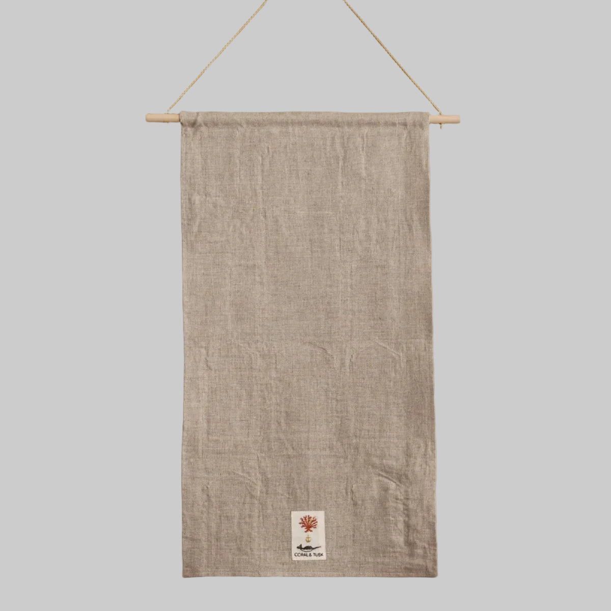 Coral and Tusk's "Holiday House" advent calendar featuring intricate embroidery and pockets for small gifts