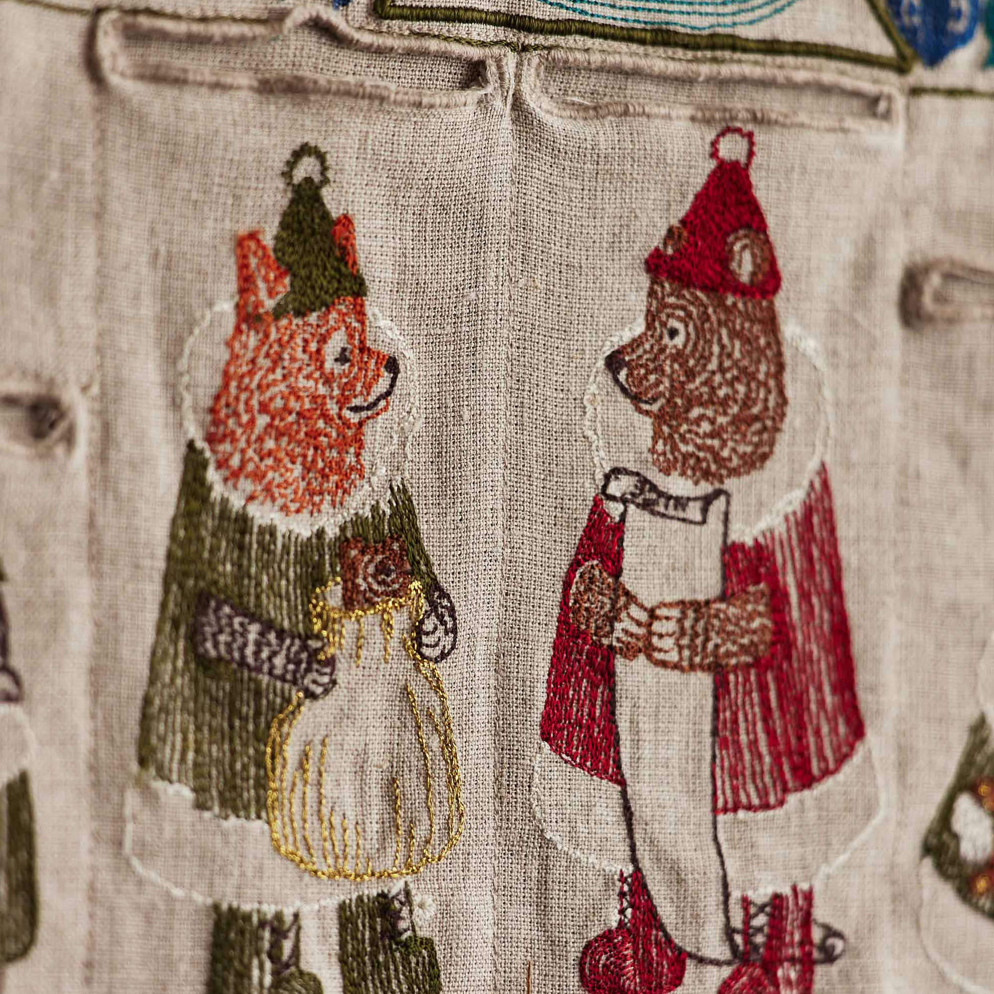 Coral and Tusk's "North Pole" advent calendar featuring intricate embroidery and pockets for small gifts