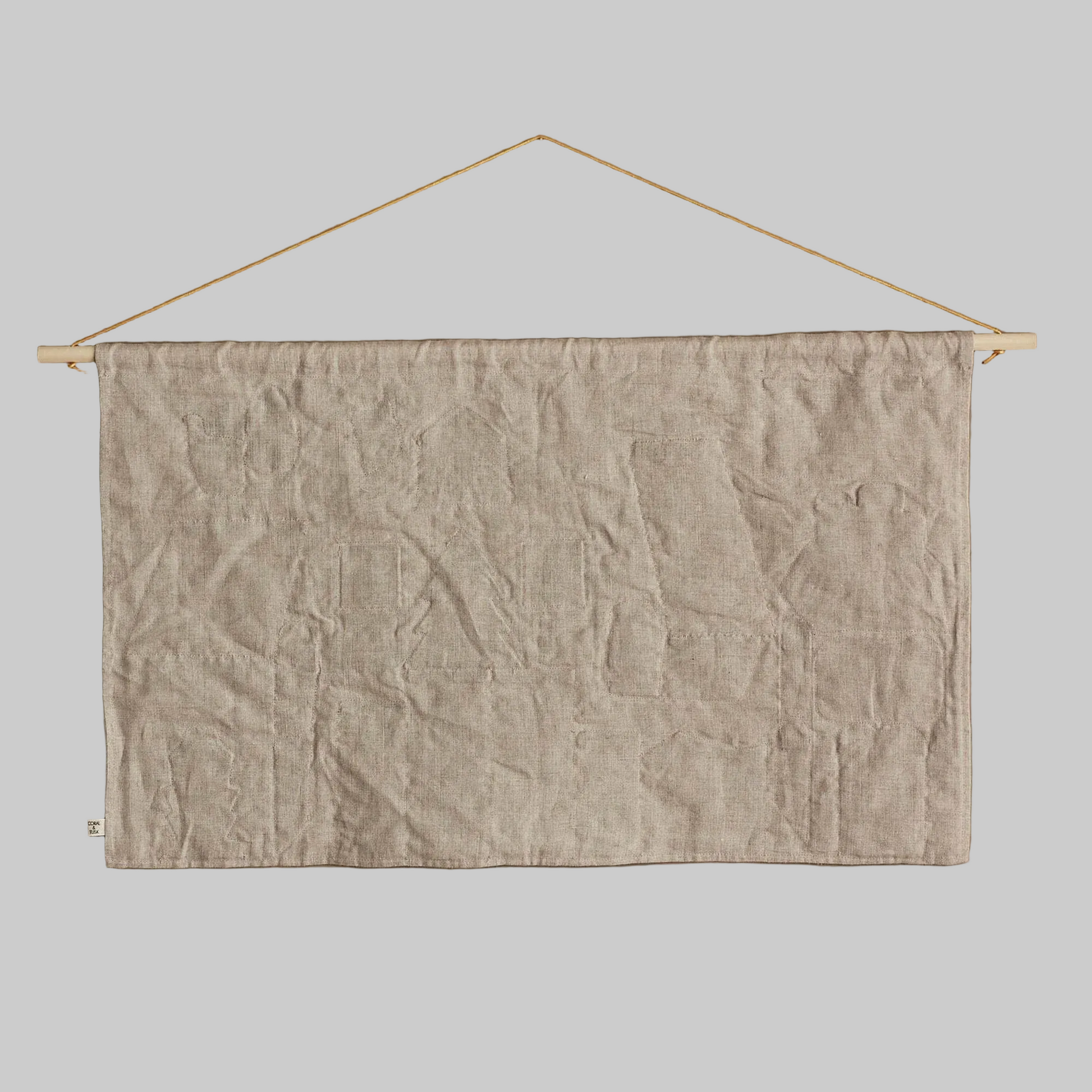 Coral and Tusk's "North Pole" advent calendar featuring intricate embroidery and pockets for small gifts