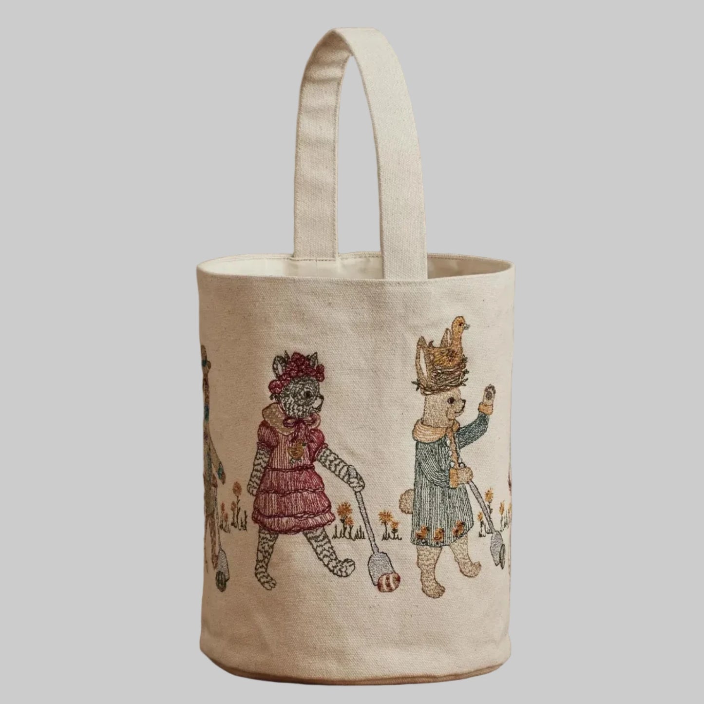 Coral and Tusk’s “Easter Egg Roll” embroidered canvas bag, featuring animals in vintage clothing rolling Easter eggs