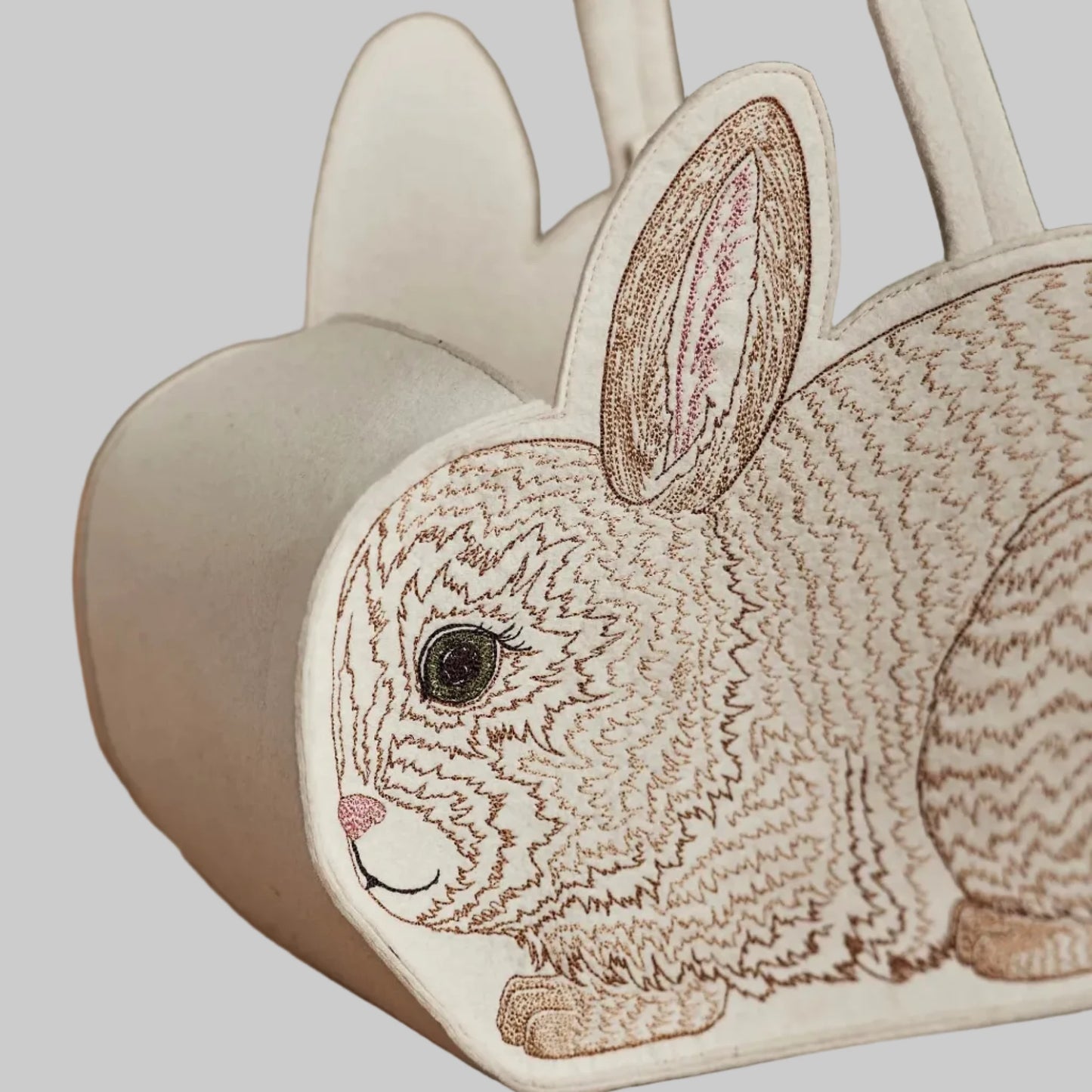 Coral and Tusk’s “Bunny” embroidered felt Easter basket, shaped like a bunny with a white cotton tail