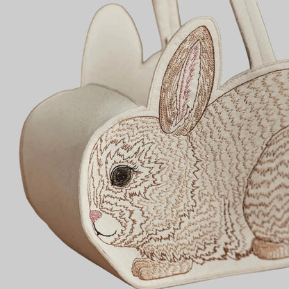 Coral and Tusk’s “Bunny” embroidered felt Easter basket, shaped like a bunny with a white cotton tail