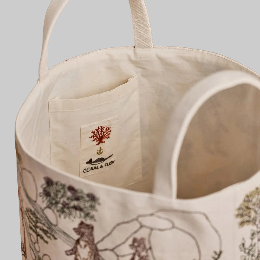 Coral and Tusk's embroidered "Forest Fun" canvas bag featuring designs of woodland creatures enjoying the forest