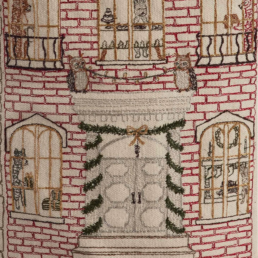 Coral and Tusk's "Home For the Holidays" embroidered canvas bucket featuring intricate designs of woodland friends decorating their city home