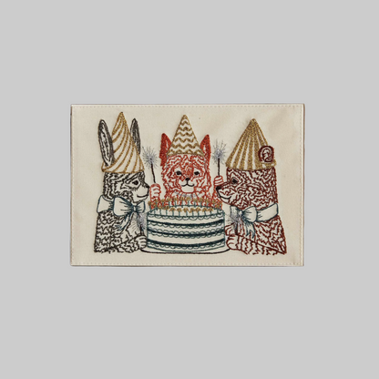 Coral and Tusk's "Birthday Celebration" embroidered keepsake card  featuring a fox, bear, and bunny around a birthday cake