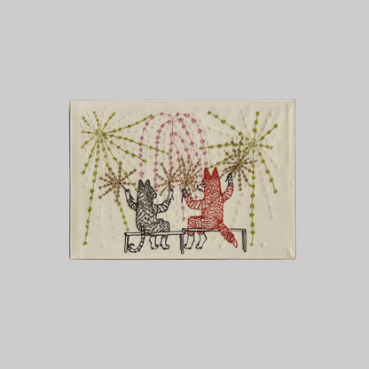 Coral and Tusk's "Summer Celebration" embroidered keepsake card  featuring a cat and fox watching fireworks