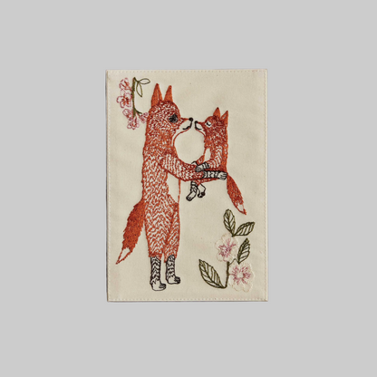 Coral and Tusk's "Fox Mama" embroidered keepsake card  featuring a mama and baby fox with florals