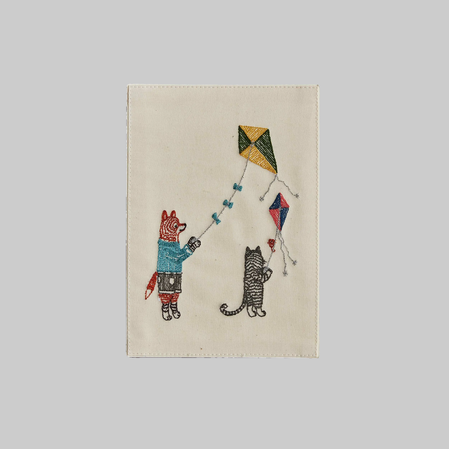 Coral and Tusk's "Flying Kites" embroidered keepsake card  featuring a fox and cat flying kites together