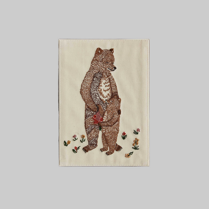 Coral and Tusk's "Mama Bear and Cub" embroidered keepsake card  featuring a mother and baby bear hugging with flowers