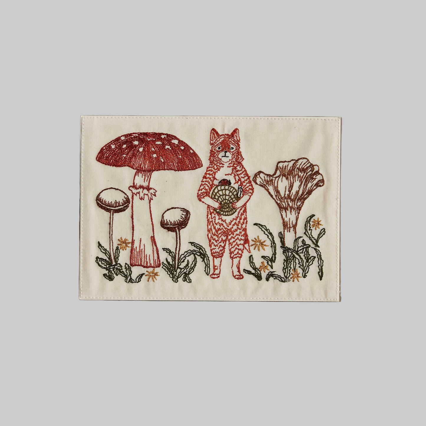 Coral and Tusk's "Fox With Mushrooms" embroidered keepsake card  featuring a fox surrounded by mushrooms