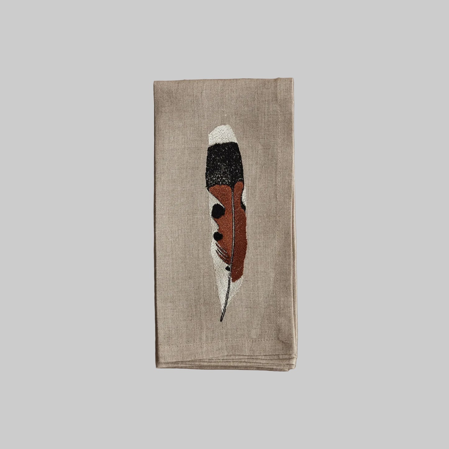 Coral and Tusk’s “Kestrel Feather” embroidered linen dinner napkin